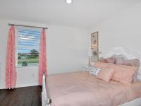 Spacious bedroom with a window at a home for rent in Apopka, Florida.