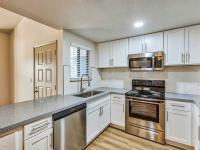 kitchen with granite countertops and stainless steel appliances and at redfield ridge apartments