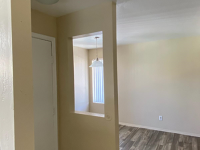 front door and dining area with vinyl wood like flooring at Monterey Apartments
