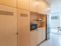 galley kitchen with birch wood cabinets at artisan