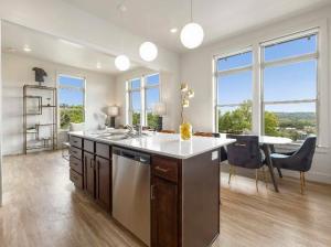 Large windows overlook the hills
