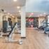 Community fitness center with various cardio and weight machines.