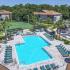 Lexington Crossing aerial view swimming pool with chairs and umbrellas