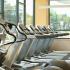 Block75 Apartments, interior, fitness center, treadmills, elliptical, large windows
