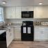 Updated Kitchen w/white cabinets and black appliances