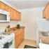 Galley Kitchen with updated white appliances, Gas range, dishwasher, and Frost free fridge
