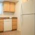 Cranberry Run Apts, Interior, white appliances, oak cabnets, marble like counter tops, refrigerator, dishwasher, window in kitchen