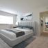 Master Bedroom with wall to wall carpet and large window