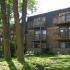 Exterior Brick Apt Building with Balconies and Patio