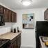 Galley Kitchen with updated black appliances, Gas range, dishwasher, and Frost free fridge