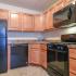 Brookstone Apts; Interior, kitchen, honey cabinets, marble counters, gas range, microwave with vent , dishwasher, frost free fridge, island