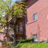 Exterior Brick Apt Building with Balconies and Patio