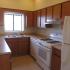A kitchen with light cabinets and appliances. | Soaring Heights Communities Rental Houses, Alamogordo, NM