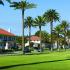 A quiet street with red and white homes and large palm trees. | Military-Friendly Houses for rent Los Angeles, CA