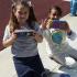 Two smiling children holding painted boxes. | Tierra Vista Communities Rental Houses, Los Angeles AFB