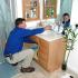 Man fixing bathroom sink | On-Site Maintenance | Watertown NY Apartments
