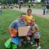 Man and 3 children at community event | Apartments in Radcliff KY