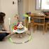 Woman playing with child in dining room