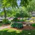 Beautiful Landscaping with outdoor benches  at Pheasant Run Apartments | Nashua NH Apartments
