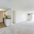 Open Floor Plan carpeting living - plank-style kitchen flooring  in apartment at Pheasant Run  | Nashua NH Apartments