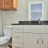 bathroom sink and toilet in studio apartment