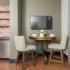 Dining table and chairs in furnished studio apartment