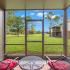 Screened Patio, table, chairs, green grass
