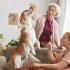 family playing with dog at home