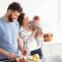 Couple with newborn at the kitchen