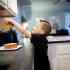 little boy making toast in the kitchen