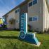 Exterior of Elements at 1600 two story building with baloons and monument sign on the lawn.