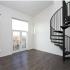 View of loft floorplan with metal spiral staircase