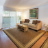 Spacious Living Room with Natural Light and Sliding Glass door to access Private Patio