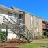 Building exterior showcasing our stairways and landings surrounded by green landscaping.
