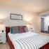 Large bedroom furnished with model furniture.