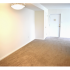 Model dining room with chandelier at Oak Tree Apartments in Newark, DE.