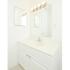 Upgraded bathroom with white sink and vanity and two large mirrors