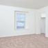 Carpeted bedroom with a closet at Victoria Crossing Apartments in Reading, PA.