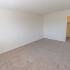 Spacious bedroom with carpet floors and closet