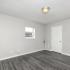 large bedroom with vinyl plank flooring
