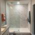 Walk-in shower with waterfall shower head in all of our homes at Triton Cay Fort Myers