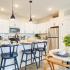 Model dining area and kitchen at Cadence Sugar Hill, Sugar Hill, GA 30518
