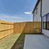backyard view with large, privacy fence and patio space