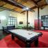 Interior view of resident lounge with billiard table and indoor shuffleboard table