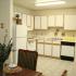 Spacious Kitchen with Wood Cabinetry and White Appliances