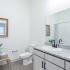 The Crockett - Bathroom with Large Vanity, Curved Shower Rods in Shower/Tub, and Plenty of Cabinent Space.