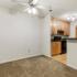 Carpeted dining area outside of the u-shape kitchen