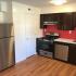 Kitchen with stainless appliances and dark cabinets