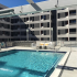Rooftop pool with longue chairs.