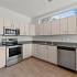 Kitchen with stainless appliances and white cabinets